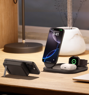 Belkin 3-in-1 Magnetic Foldable Wireless Charger and Magnetic Power Bank Bundle shown charging iPhone, Apple Watch, and AirPods on a wooden desk for convenient all-in-one power.
