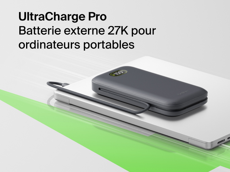 UltraCharge Pro Laptop Power Bank 27K portable charger with integrated cable and digital display resting on a laptop for high-capacity on-the-go charging