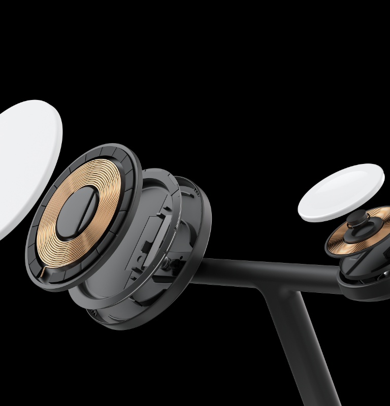 The smaller charging pad of the Belkin BoostCharge Pro 3-in-1 Wireless Charging Stand with Qi2 15W is shown in an exploded view, highlighting the internal structure and advanced charging technology used for devices like the Apple Watch.