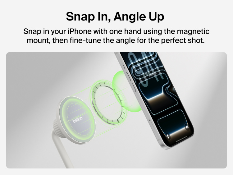 A visual demonstration shows an iPhone aligning with the Belkin magnetic phone tripod mount, highlighted by green magnetic guide rings. The phone appears ready to snap into place with one hand. Text on the left reads &ldquo;Snap In, Angle Up&rdquo; and explains that users can quickly attach their phone and adjust the mount angle for the perfect shot.