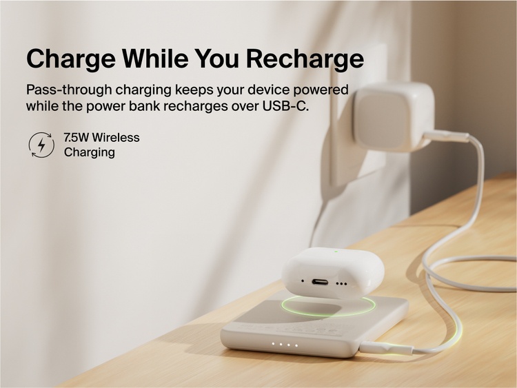 Belkin BoostCharge Slim Magnetic Power Bank 5K shown wirelessly charging earbuds while recharging via USB-C, demonstrating 7.5W pass-through charging functionality.