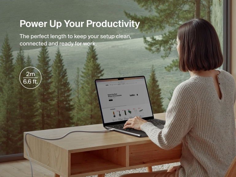 Belkin BoostCharge Pro Braided USB-C to USB-C Cable 60W in 2m (6.6ft) length shown connecting a laptop in a serene home office setup, offering extended reach for an organized and productive workspace.