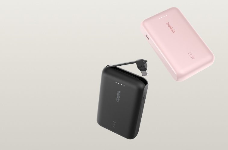 BoostCharge Power Bank 10K with Integrated Cable shown in black and pink, featuring a compact design with a built-in charging cable and LED battery indicators against a neutral background.