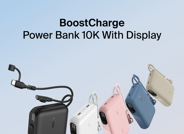Belkin BoostCharge Power Bank 10K with Display shown in five colors—black, white, pink, blue, and sand—featuring a built-in USB-C cable, LED battery percentage display, and compact design for on-the-go charging.