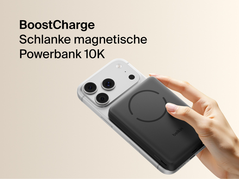 Belkin BoostCharge Slim Magnetic Power Bank 10K magnetically attached to iPhone showing slim portable design for wireless charging