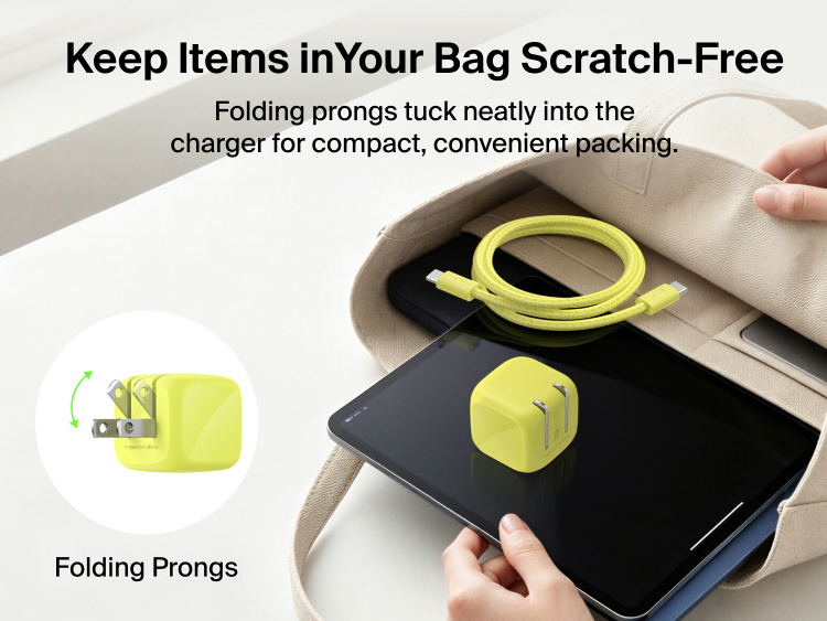 Belkin BoostCharge Compact USB-C Charger 30W with folding prongs and braided USB-C cable packed with a tablet in a bag for convenient travel.