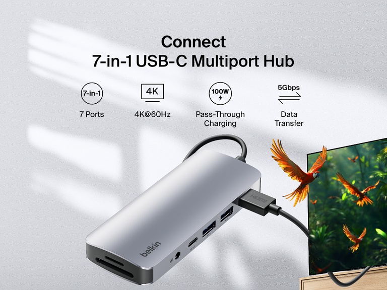 影像顯示 Belkin Connect 7 合 1 USB-C 多埠集線器，並標記各項特點，包括 4K@60Hz 顯示、100W 直通充電、5Gbps 資料傳輸和七個連接埠。