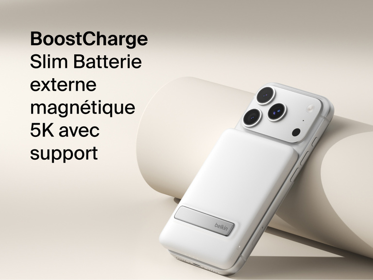 Belkin BoostCharge Slim Magnetic Power Bank 5K with Qi2 wirelessly attached to a smartphone, featuring a slim magnetic design with integrated card storage for portable on-the-go charging.