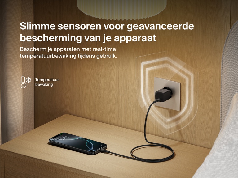 Belkin BoostCharge USB-C Wall Charger 25W plugged into a bedside outlet, showcasing real-time temperature monitoring for advanced device protection and safe charging.