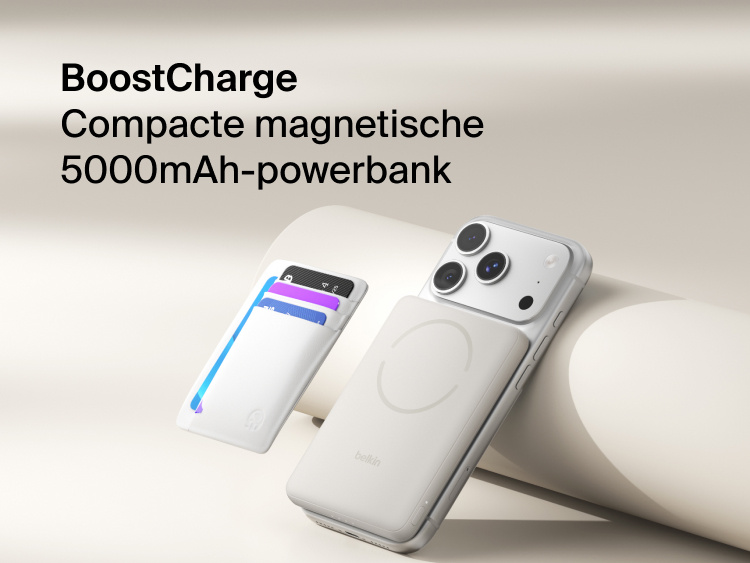 Belkin BoostCharge Slim Magnetic Power Bank 5K with Qi2 wirelessly attached to a smartphone, featuring a slim magnetic design with integrated card storage for portable on-the-go charging.
