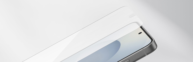 Tempered glass screen protector being aligned and applied onto a Samsung Galaxy smartphone, shown in a side view against a clean white background.