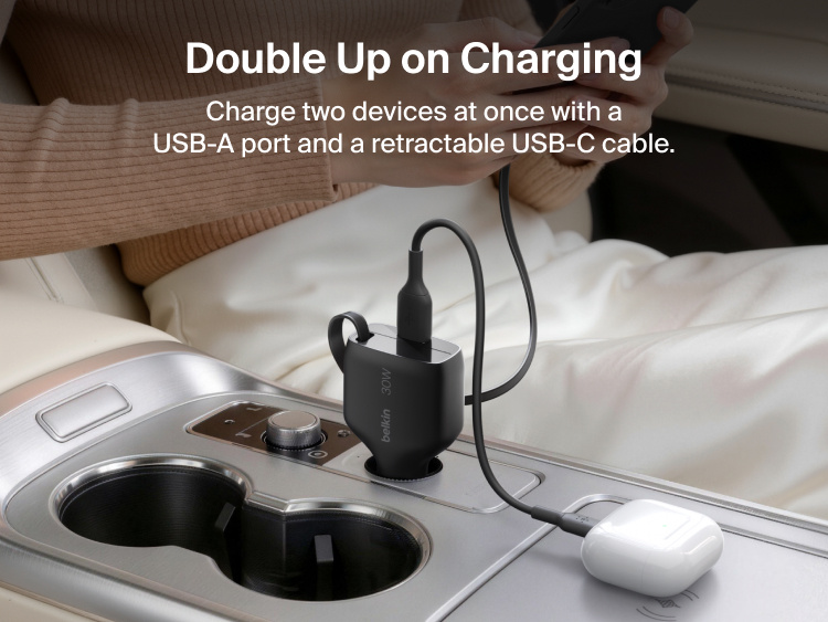 Belkin BoostCharge Retractable Car Charger 30W charging two devices simultaneously with a retractable USB-C cable and USB-A port inside a vehicle.