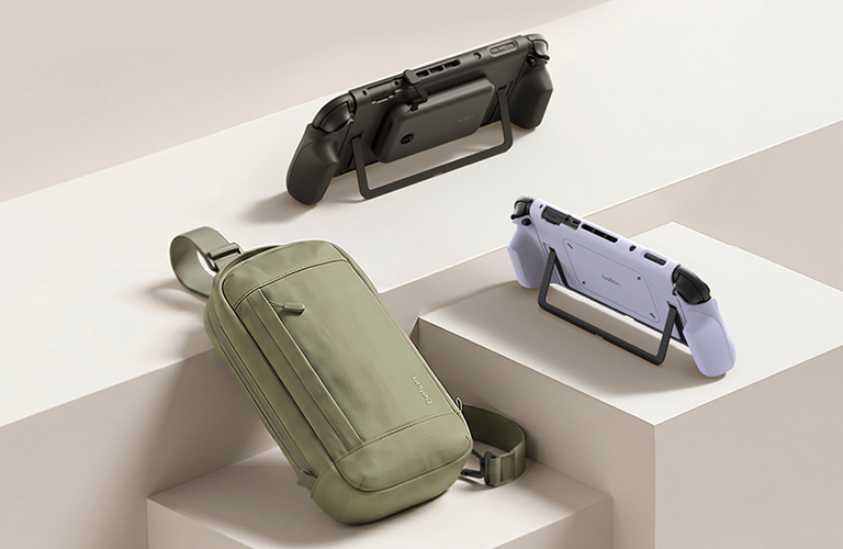Universal gaming setup with Nintendo Switch 2 consoles on stands and a crossbody carry bag displayed on minimalist steps, showcasing portable gaming accessories for travel and on-the-go use