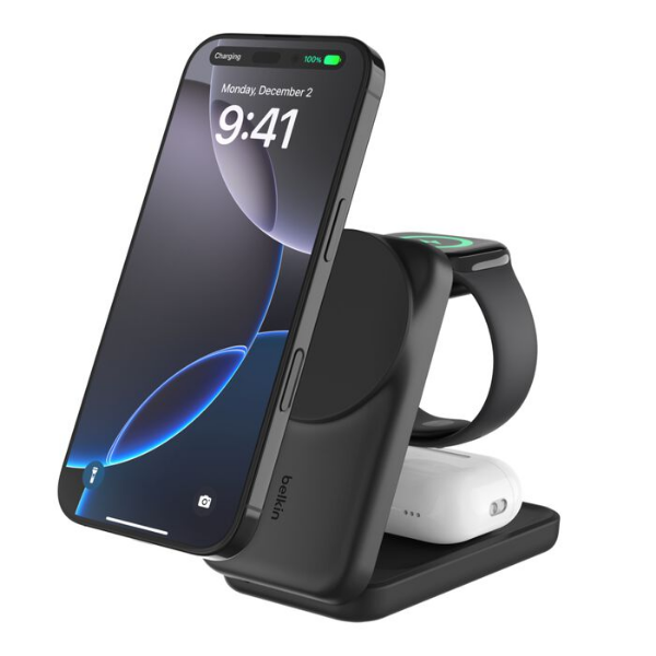 Belkin 3-in-1 wireless charging station in black, holding a smartphone, wireless earbuds case, and smartwatch, all charging simultaneously.