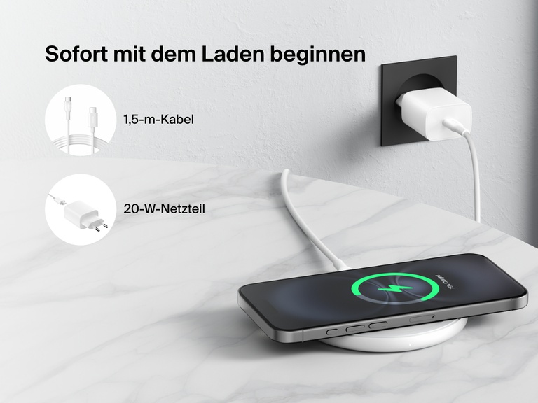 A black Belkin BoostCharge Wireless Charging Pad 15W is shown on a marble surface charging a smartphone, with text highlighting that it includes a 5 ft. (1.5m) cable and a 20W power adapter for easy setup right out of the box.