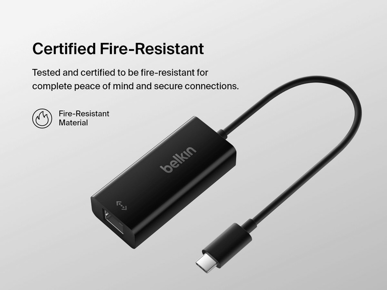 Belkin USB-C to Gigabit Ethernet Adapter is displayed on a light background with text highlighting its certified fire-resistant material for enhanced safety and secure connections.