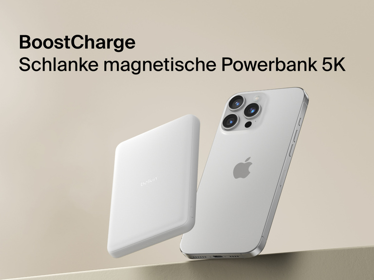 Belkin BoostCharge Slim Magnetic Power Bank 5K shown magnetically attached to a smartphone beside a slim wallet accessory, highlighting its compact portable charging design.