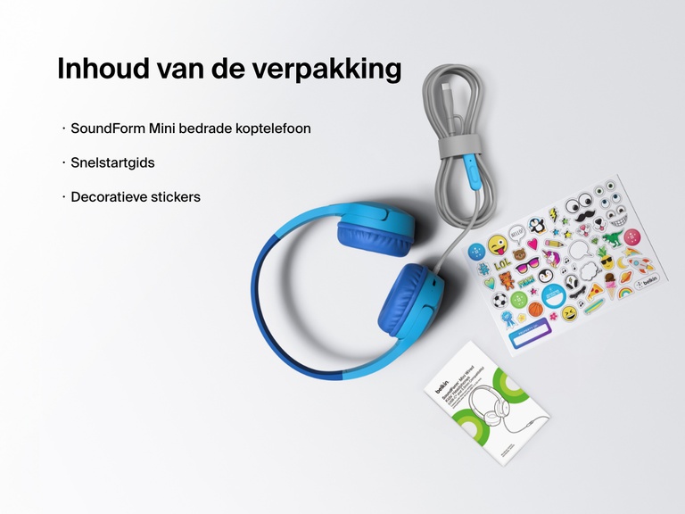 Flat lay image showing the contents of the Belkin SoundForm Mini Wired Headphones box, including the headphones, a quick start guide, and a sheet of decorative stickers.