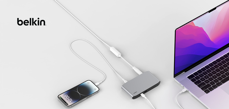 An iPhone and laptop connected to a Belkin Thunderbolt dock.