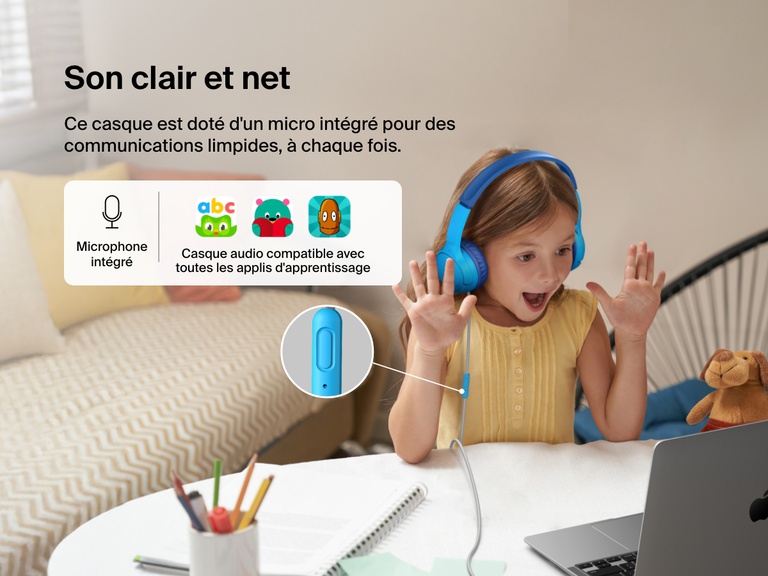 Young girl using Belkin Wired On-Ear Headphones for Kids with a built-in microphone while video chatting on a laptop, highlighting clear audio and compatibility with learning apps for classroom use.