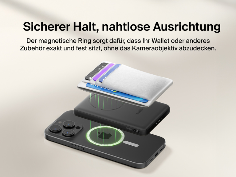 Belkin BoostCharge Slim Magnetic Power Bank 5K shown magnetically aligned between a smartphone and wallet accessory, demonstrating precise magnetic ring for secure attachment and camera-safe design.