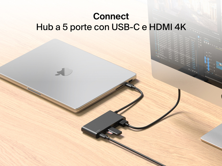 Belkin Connect 5-Port USB-C Hub with 4K HDMI links a MacBook to an external monitor and multiple devices on a wooden desk.