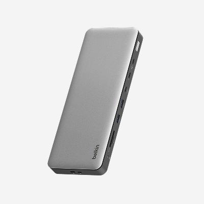 Belkin Connect Thunderbolt 4 Dock shown at an angled view, featuring multiple Thunderbolt, USB, and display ports in a sleek aluminum design for high-performance workstation connectivity.