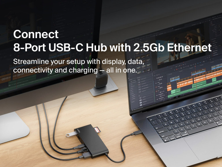 Belkin Connect 8-Port USB-C Hub with 2.5Gb Ethernet connecting a laptop and desktop monitor, supporting high-speed data transfer, display extension, and device charging for streamlined workspace setup.