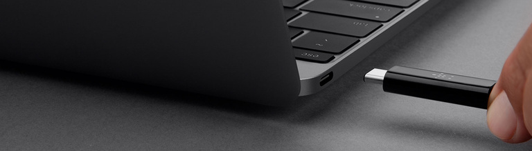 pluging usb-c cable into laptop