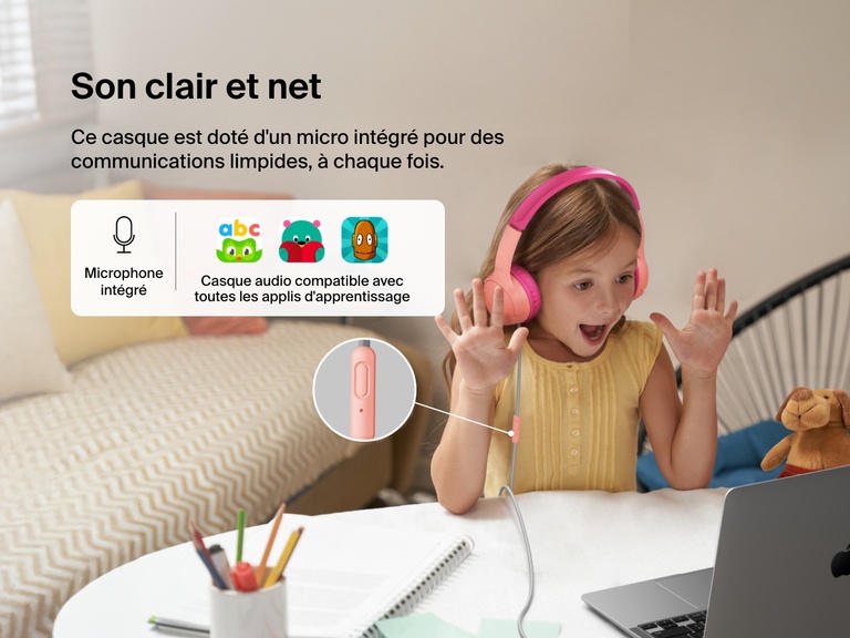 Young girl using Belkin Wired On-Ear Headphones for Kids with a built-in microphone while video chatting on a laptop, highlighting clear audio and compatibility with learning apps for classroom use.