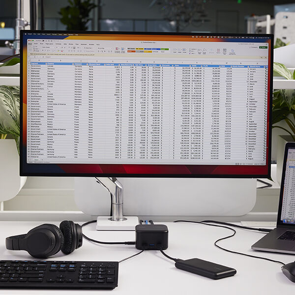 A monitor connected with a dock with a cat5e cable.