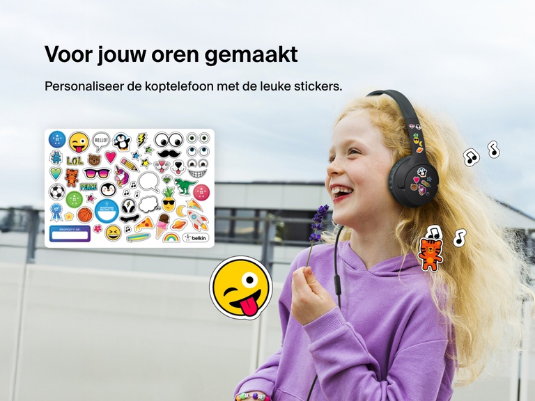 Smiling girl wearing Belkin Wired On-Ear Headphones for Kids decorated with colorful stickers, highlighting the headset’s personalization feature with included fun sticker sheet.