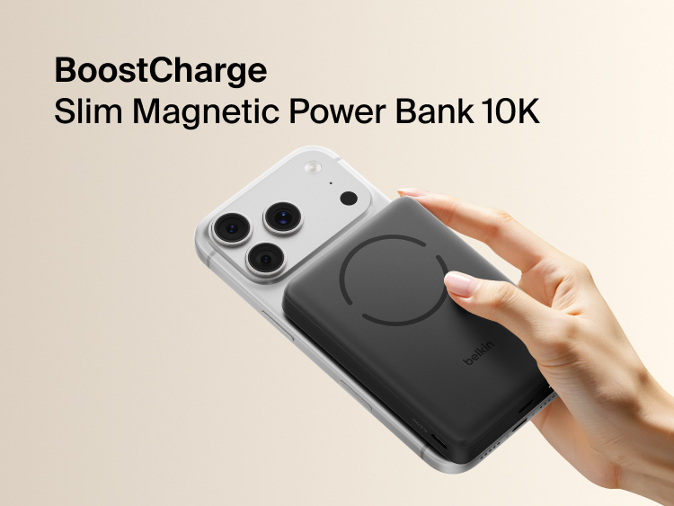 Slim Magnetic Power Bank 10K with Qi2 magnetically attached to smartphone held in hand demonstrating wireless charging alignment