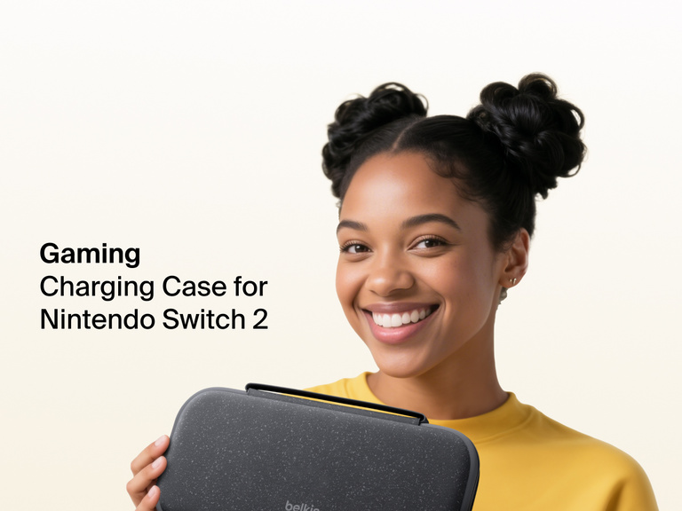 Smiling woman in a yellow shirt holds the Belkin Gaming Charging Case for Nintendo Switch 2, designed for portable protection and on-the-go charging.