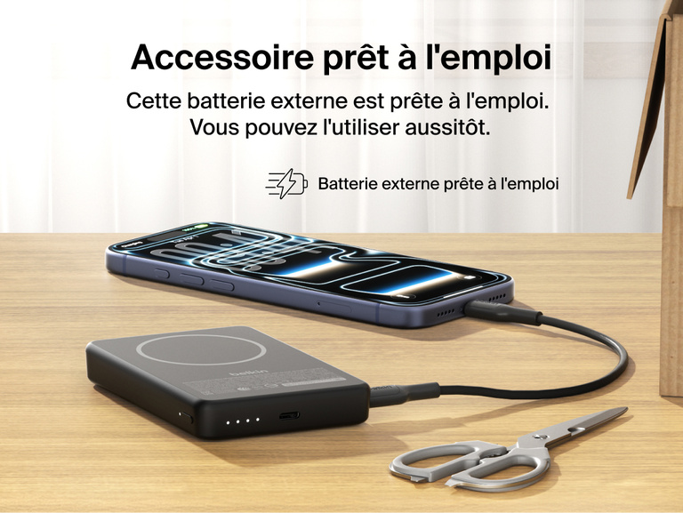 Slim Magnetic Power Bank 10K with Qi2 charging smartphone on desk with precharged battery indicator lights visible