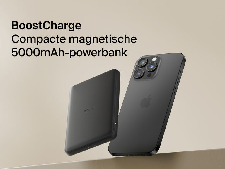 Belkin BoostCharge Slim Magnetic Power Bank 5K shown magnetically attached to a smartphone beside a slim wallet accessory, highlighting its compact portable charging design.