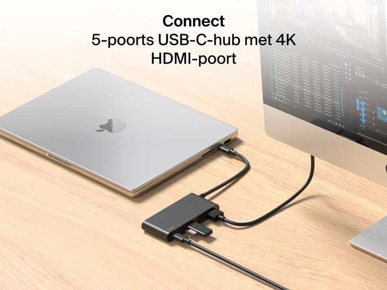 Belkin Connect 5-Port USB-C Hub with 4K HDMI links a MacBook to an external monitor and multiple devices on a wooden desk.