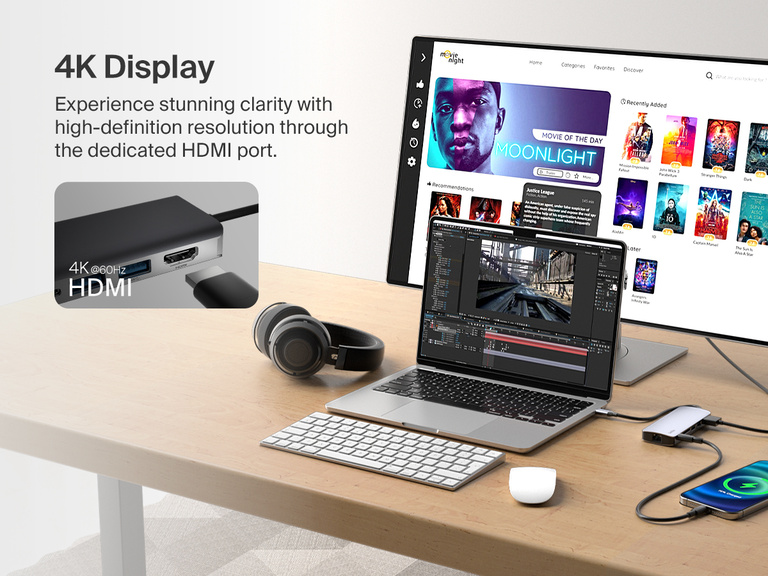 A Belkin Connect USB-C 6-in-1 Multiport Hub is connected to a laptop and an external monitor, demonstrating its 4K@60Hz HDMI output for high-definition display clarity while also charging a smartphone.