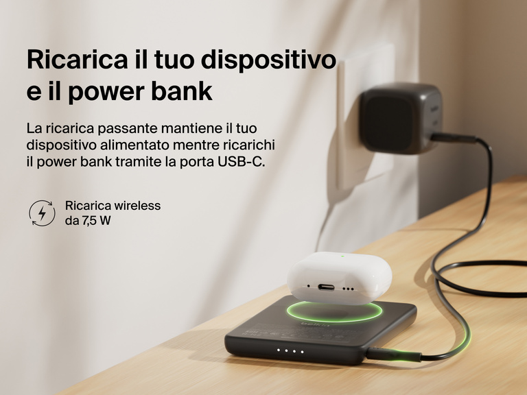 Belkin BoostCharge Slim Magnetic Power Bank 5K shown wirelessly charging earbuds while recharging via USB-C, demonstrating 7.5W pass-through charging functionality.