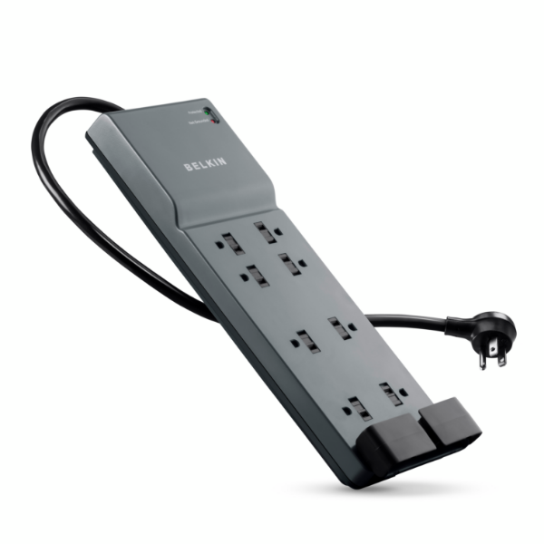 Belkin black surge protector power strip with twelve outlets, angled flat plug, two wide-spaced outlets for large adapters, and indicator lights showing protection and grounding status.