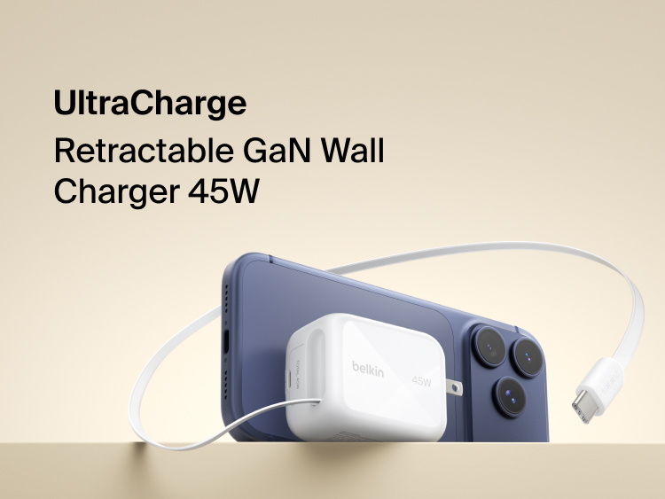 Belkin UltraCharge 45W retractable GaN wall charger connected to smartphone, featuring built-in USB-C cable for fast, compact charging