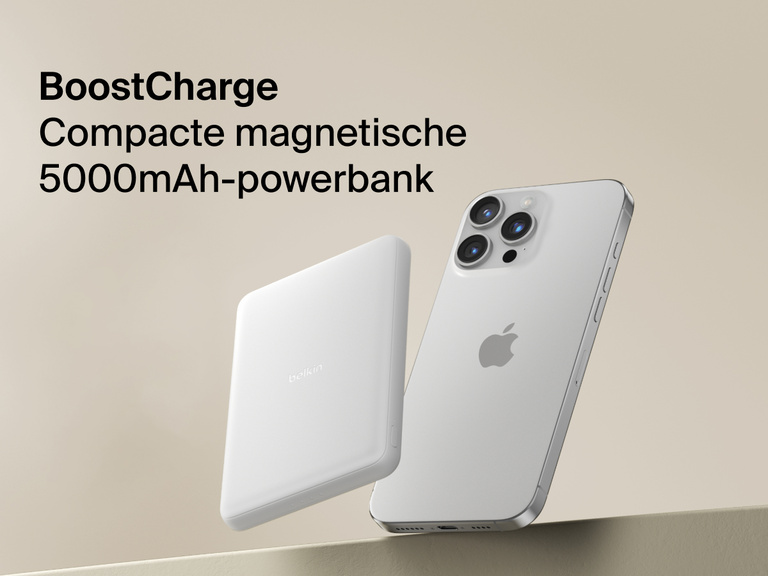 Belkin BoostCharge Slim Magnetic Power Bank 5K shown magnetically attached to a smartphone beside a slim wallet accessory, highlighting its compact portable charging design.