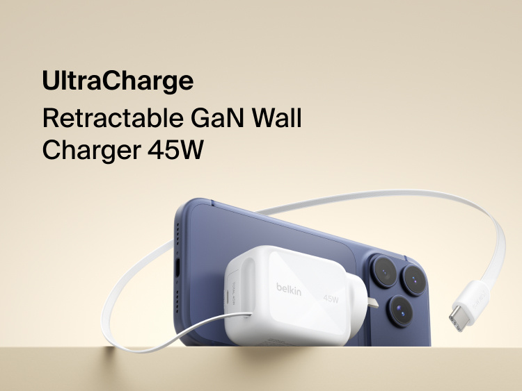 Belkin UltraCharge 45W retractable GaN wall charger connected to smartphone, featuring built-in USB-C cable for fast, compact charging