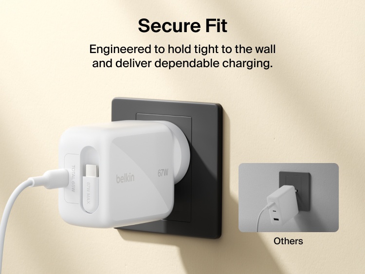 Belkin UltraCharge Retractable GaN Wall Charger 67W securely plugged into wall outlet with built-in retractable USB-C cable for stable, dependable fast charging.