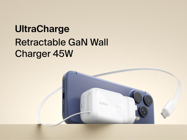 Belkin UltraCharge 45W retractable GaN wall charger connected to smartphone, featuring built-in USB-C cable for fast, compact charging