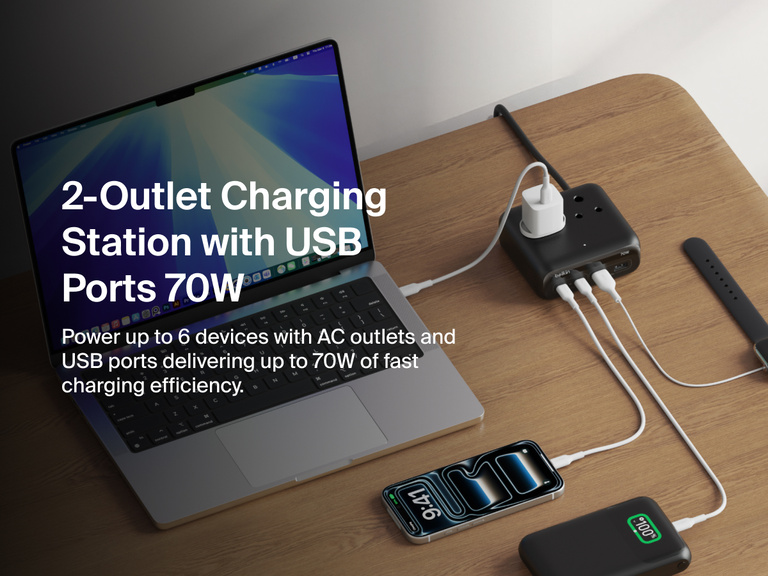 Belkin 3-Outlet Charging Station with 2 USB-A and 2 USB-C ports delivering 70W of power sits on a desk, charging a laptop, smartphone, smartwatch, and other devices simultaneously.