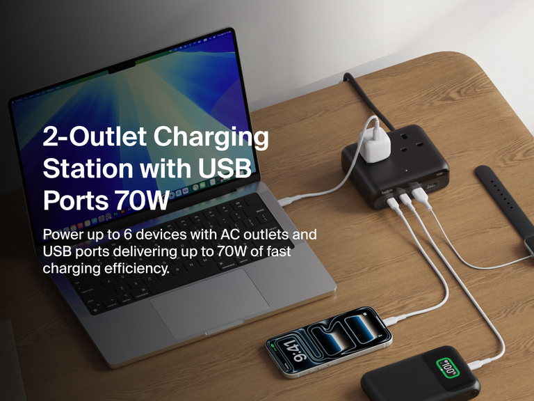 Belkin 3-Outlet Charging Station with 2 USB-A and 2 USB-C ports delivering 70W of power sits on a desk, charging a laptop, smartphone, smartwatch, and other devices simultaneously.