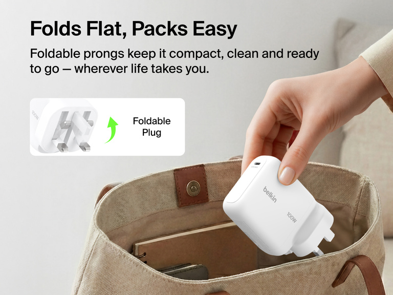 BoostCharge USB-C GaN Wall Charger 100W with foldable prongs being placed into a travel bag to highlight compact portable design for everyday charging on the go