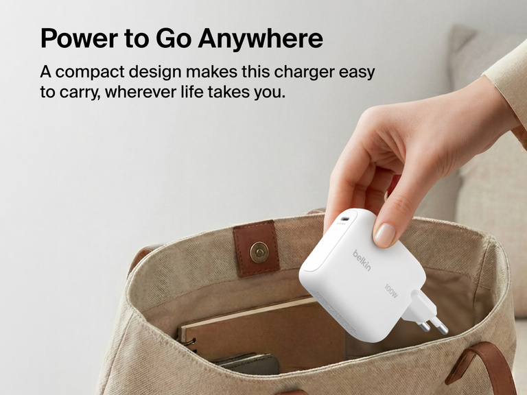 BoostCharge USB-C GaN Wall Charger 100W with foldable prongs being placed into a travel bag to highlight compact portable design for everyday charging on the go
