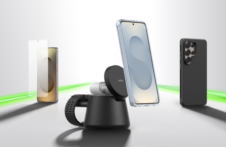 Samsung smartphone accessories displayed on a sleek surface, including a phone with a screen protector, a MagSafe-style wireless charger stand, and protective cases, highlighted by a glowing green accent line to represent the connected ecosystem.